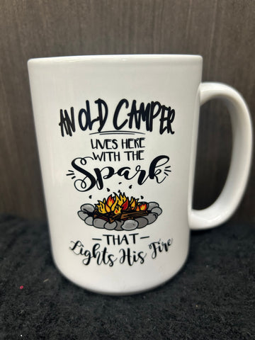 AN OLD CAMPER LIVES HERE WITH THE SPARK THAT LIGHTS HIS FIRE