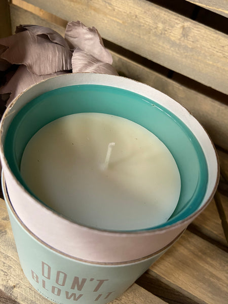 Wit- seriously funny candle in a jar. Aqua blue/green